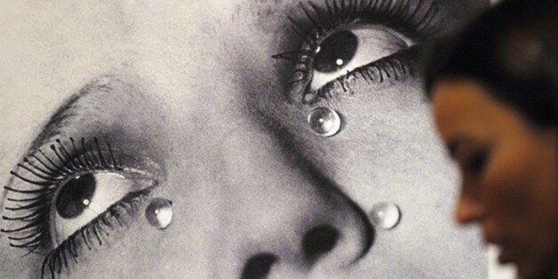 A visitor looks at the photo 'Tears' by Man Ray (1932) during the opening of the exhibition 'Tears of Eros' at the Thyssen-Bornemisza museum in Madrid, on October 19, 2009. AFP PHOTO/DOMINIQUE FAGET (Photo credit should read DOMINIQUE FAGET/AFP/Getty Images)