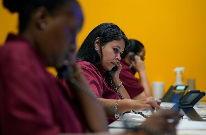 Tnisha Nation, left, Sandrea Guerrero, center, and Elena Mojica reach out to families in the San Antonio Independent School D