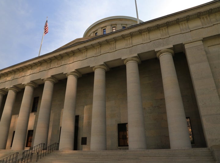 The Ohio Statehouse, located in Columbus, Ohio, is the house of government for the state of Ohio. The Greek Revival building houses the Ohio General Assembly and the ceremonial offices of the governor, lieutenant governor, treasurer, and auditor.