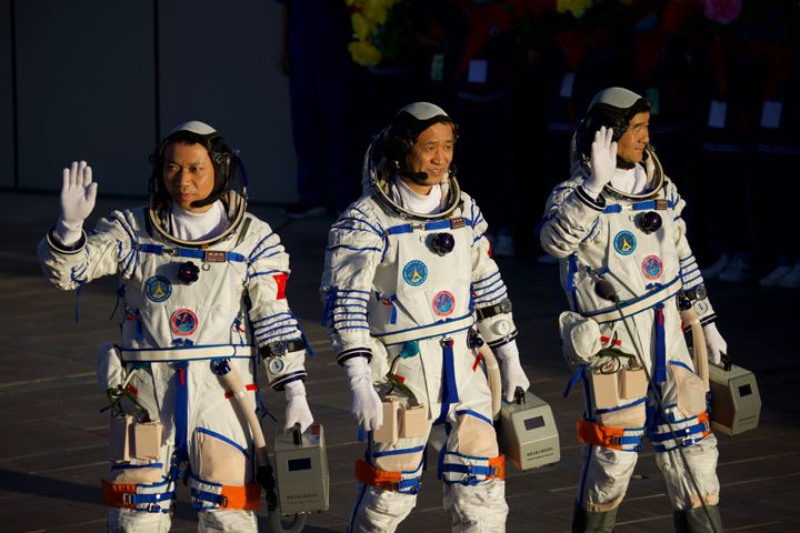 Astronauts (from left to right) Tang Hongbo, Nie Haisheng, and Liu Boming depart for the launch site of the Shenzhou-12 spacecraft at the Jiuquan Satellite Launch Center on June 17, 2021, in Jiuquan, Gansu Province, China. 