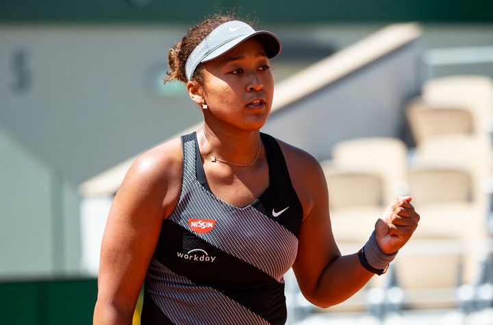 Naomi Osaka of Japan celebrated during her first-round victory at the French Open but later withdrew from the tournament. 