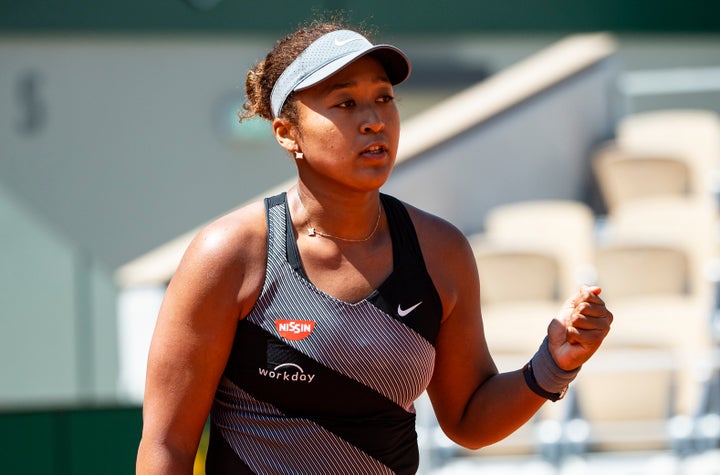 Naomi Osaka of Japan celebrated during her first-round victory at the French Open but later withdrew from the tournament. 