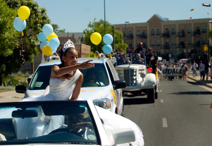 Denver's Miss Juneteenth 2007 Rebekah Johnson, 17, throws candy to some of the kids watching the parade.