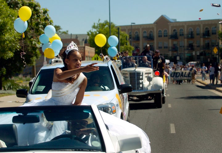 Denver's Miss Juneteenth 2007 Rebekah Johnson, 17, throws candy to some of the kids watching the parade. 