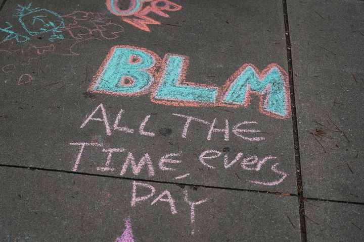 Chalked street art photographed at the Juneteenth celebration in the Greenwood District on June 19, 2020, in Tulsa, Oklahoma.