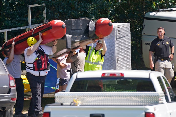 Rescue personnel stage along the Dan River in Eden, N.C., Friday, June 18, 2021. (AP Photo/Gerry Broome)