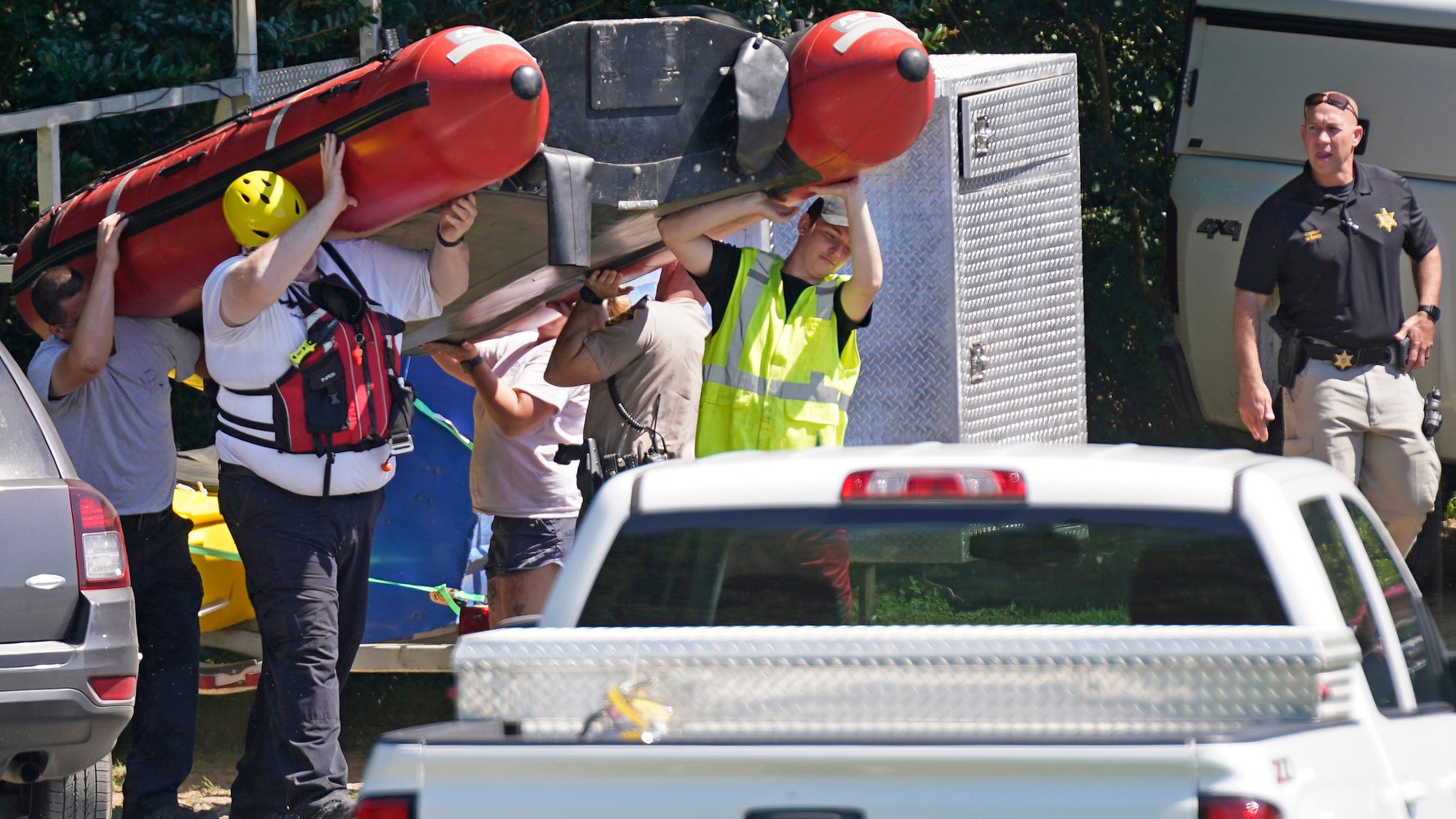 Rescuers Search For Survivors After Family Goes Over Dam On Float