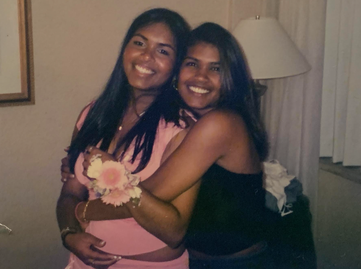 The author with her sister (right) in 2004 at a prom after-party. The author notes, "Prom and grad were the only times I wore makeup."