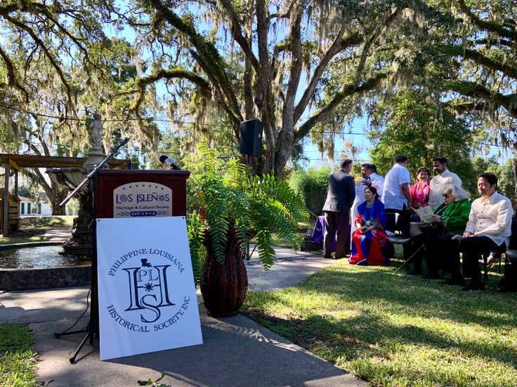 The podium and local dignitaries at the St. Malo marker dedication ceremony.