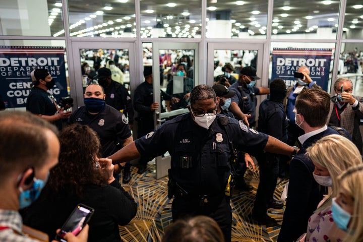 Election challengers demand to enter to observe absentee ballot counting after the 2020 general election in Detroit on Nov. 4. One of the Democratic measures would provide a minimum distance between a poll observer and any voter or ballot.