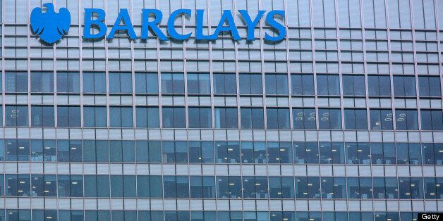 The Barclays Plc logo sits on a glass wall at the top of the company's headquarters in the Canary Wharf business and financial district in London, U.K., on Monday, Feb. 11, 2013. Barclays Plc Chief Executive Officer Antony Jenkins's pledges to shred the legacy of his predecessor and fix the lender's culture are distracting from the difficulty he has in reviving profit at Britain's biggest investment bank. Photographer: Jason Alden/Bloomberg via Getty Images