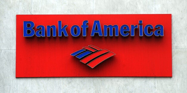 The Bank of America logo is seen at a branch in Hollywood on October 19, 2010. Two top US banks are moving on the offensive as they struggle to put the foreclosures quagmire behind them, but the scandal continues to menace the financial sector. Bank of America, the country's largest bank by assets, said it was lifting freezes on more than 100,000 foreclosure cases in 23 states, insisting it had not found any flaws in their processing. Bank of America, which had announced a nationwide moratorium on foreclosures to review its paperwork on October 8, nevertheless said the freeze will stay in place for now in the remaining 27 states. AFP PHOTO/Mark RALSTON (Photo credit should read MARK RALSTON/AFP/Getty Images)