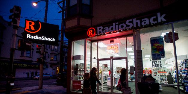 Pedestrians walk past a RadioShack Corp. store in San Francisco, California, U.S., on Saturday, June 7, 2014. RadioShack Corp. is expected to release earnings figures on June 10. Photographer: David Paul Morris/Bloomberg via Getty Images