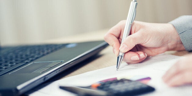 Businesswoman checking report. Toned photo, shallow depth of field.