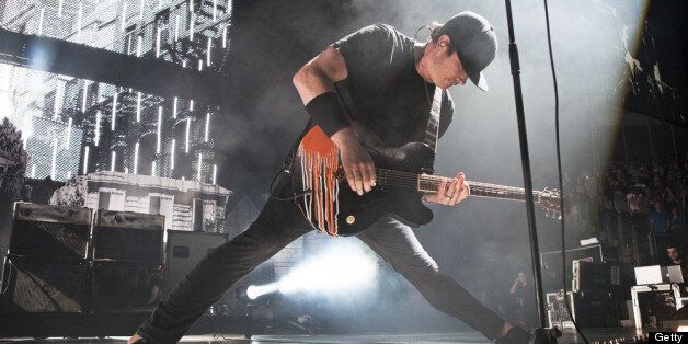 LONDON, ENGLAND - JUNE 08: Tom DeLonge of Blink 182 performs on stage at O2 Arena on June 8, 2012 in London, United Kingdom. (Photo by Marc Broussely/Redferns via Getty Images)