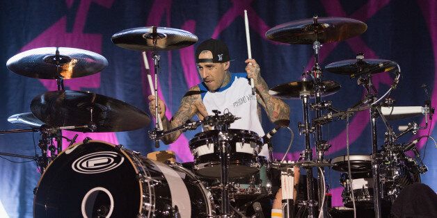 CHICAGO, IL - SEPTEMBER 14: (EDITOR'S NOTE: Image not to be used in any publication devoted exclusively or predominantly to artist pictured) Travis Barker of Blink-182 performs on stage on Day 2 of Riot Fest and Carnival 2013 at Humboldt Park on September 14, 2013 in Chicago, Illinois. (Photo by Daniel Boczarski/Redferns via Getty Images)