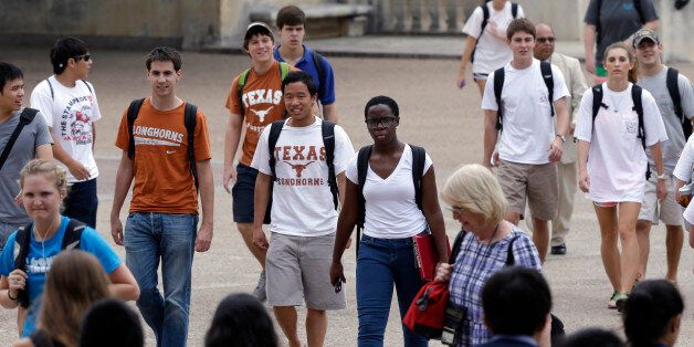 FILE - In this Thursday, Sept. 27, 2012 file photo, students walk through the University of Texas at Austin campus in Austin, Texas. This giant flagship campus - once slow to integrate - is now among the most diverse the country. A decade ago, the U.S. Supreme Court essentially sided with race in that argument, upholding the right of colleges to make limited use of racial preferences in admitting students. But in a ruling due in June 2013, the Court is widely expected to roll back that ruling. Such an outcome would shift the focus more toward giving a boost to socio-economically disadvantaged students, regardless of race. (AP Photo/Eric Gay, File)