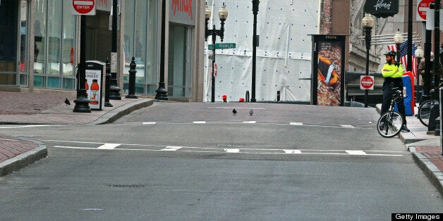 BOSTON - APRIL 19: The busy lunch time would usually be approaching at, but the scene near Downtown Crossing was anything but as a lockdown-in-place is in effect in Boston during the during the ongoing manhunt for a suspect in the terrorist bombing of the 117th Boston Marathon earlier this week. (Photo by Jim Davis/The Boston Globe via Getty Images)