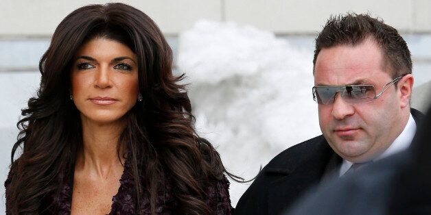 Teresa Giudice, 41, (L) and her husband Giuseppe "Joe" Giudice, 43, exit the Federal Court in Newark, New Jersey, March 4, 2014. REUTERS/Eduardo Munoz (UNITED STATES - Tags: CRIME LAW ENTERTAINMENT)