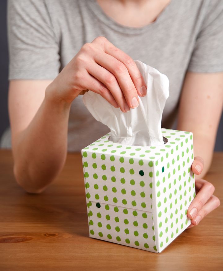 Hand Pulling Tissue out of Box