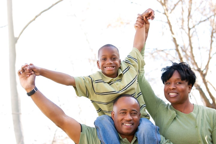 African American Family Having Fun in the Park.