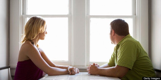 Couple staring out the window.