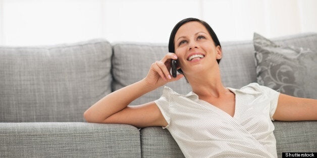 happy young woman sitting on...