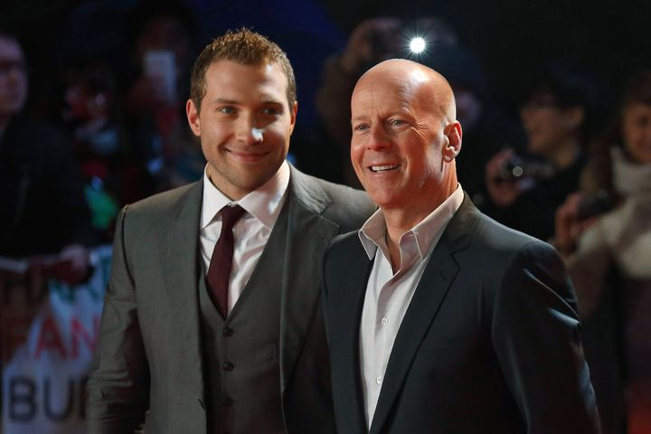 Australian actor Jai Courtney (L) and US actor Bruce Willis (R) pose for photographers while arriving for the UK premiere of 'A Good Day To Die Hard', the fifth film in the Die Hard franchise, in central London on February 7, 2013. AFP PHOTO / JUSTIN TALLIS (Photo credit should read JUSTIN TALLIS/AFP/Getty Images)