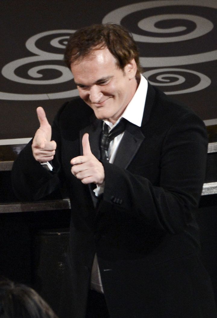 HOLLYWOOD, CA - FEBRUARY 24: Writer/director Quentin Tarantino celebrates before he accepts the Best Writing - Original Screenplay award for 'Django Unchained' onstage during the Oscars held at the Dolby Theatre on February 24, 2013 in Hollywood, California. (Photo by Kevin Winter/Getty Images)