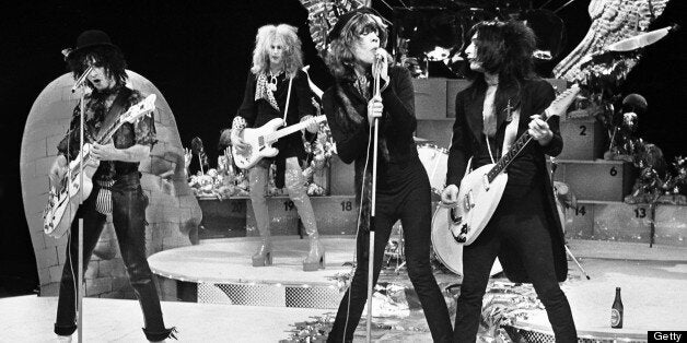 HILVERSUM, NETHERLANDS - DECEMBER 06: The New York Dolls perform live on TopPop TV show for AVRO TV at Hilversum Studios on December 06 1973. L-R: Guitarist Sylvain Sylvain, bassist Arthur Kane (1949-2004), David Johansen (vocals) and guitarist Johnny Thunders (1952-1991). (Photo by Gijsbert Hanekroot/Redferns) 