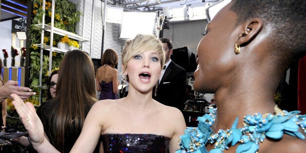 LOS ANGELES, CA - JANUARY 18: Actresses Jennifer Lawrence (L) and Lupita Nyong'o attend the 20th Annual Screen Actors Guild Awards at The Shrine Auditorium on January 18, 2014 in Los Angeles, California. (Photo by Kevork Djansezian/Getty Images)