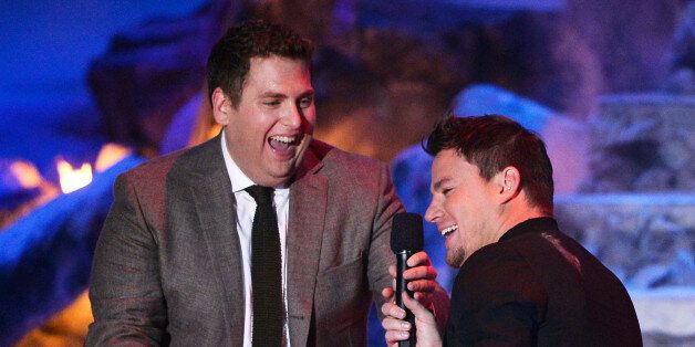 LOS ANGELES, CA - APRIL 13: Actor Jonah Hill (L) presents the Trailblazer Award to honoree Channing Tatum onstage at the 2014 MTV Movie Awards at Nokia Theatre L.A. Live on April 13, 2014 in Los Angeles, California. (Photo by Kevork Djansezian/Getty Images for MTV)