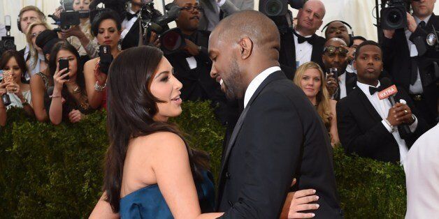 Kanye West (R) and Kim Kardashian (L) arrive at the Costume Institute Benefit at The Metropolitan Museum of Art May 5, 2014 in New York. AFP PHOTO/Timothy A. CLARY (Photo credit should read TIMOTHY A. CLARY/AFP/Getty Images)