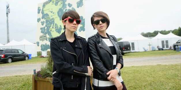 DOVER, DE - JUNE 21: Sara Quin and Tegan Quin of Tegan and Sara pose backstage during day 3 of the Firefly Music Festival on June 21, 2014 in Dover, Delaware. (Photo by Michael Loccisano/Getty Images for Firefly Music Festival)