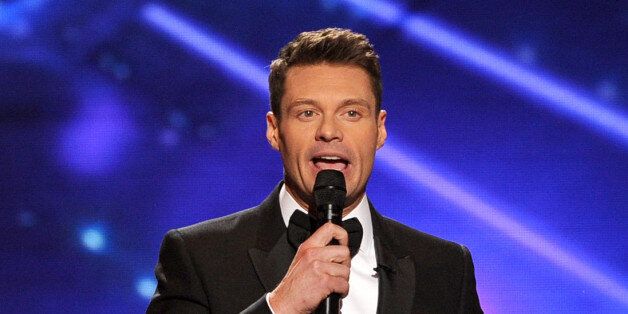 LOS ANGELES, CA - MAY 21: Host Ryan Seacrest speaks onstage during Fox's 'American Idol' XIII Finale at Nokia Theatre L.A. Live on May 21, 2014 in Los Angeles, California. (Photo by Kevin Winter/Getty Images)