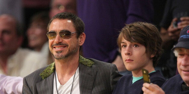 LOS ANGELES, CA - MAY 04: Robert Downey Jr. (L) and his son Indio Downey (R) attend the Los Angeles Lakers against Utah Jazz playoff game at the Staples Center on May 4, 2008 in Los Angeles, California. (Photo by Noel Vasquez/Getty Images) 