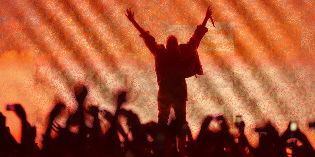 MANCHESTER, TN - JUNE 13: Artist Kanye West performs at the Bonnaroo Music & Arts Festival on June 13, 2014 in Manchester, Tennessee. (Photo by Jason Merritt/Getty Images)