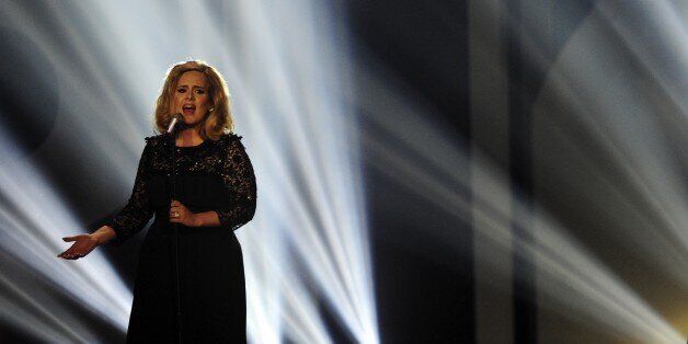 British singer-songwriter Adele performs on stage at the BRIT Awards 2012 in London on February 21, 2012. AFP PHOTO / LEON NEAL (Photo credit should read LEON NEAL/AFP/Getty Images)