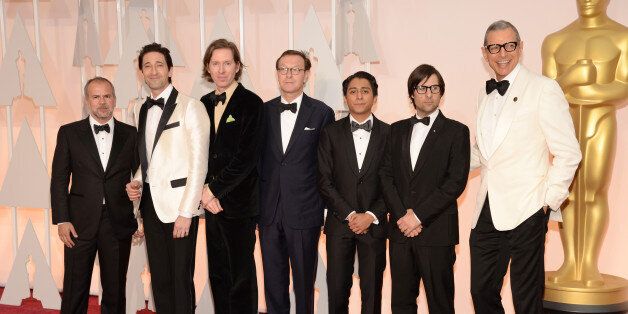 HOLLYWOOD, CA - FEBRUARY 22: (L-R) Producer Jeremy Dawson, actor Adrien Brody, filmmaker Wes Anderson, screenwriter Hugo Guinness, Tony Revolori, actor Jason Schwartzmann and Jeff Goldblum attend the 87th Annual Academy Awards at Hollywood & Highland Center on February 22, 2015 in Hollywood, California. (Photo by Kevin Mazur/WireImage)