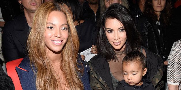 NEW YORK, NY - FEBRUARY 12: (L-R) Beyonce, Kim Kardashian, and daughter North attend the adidas Originals x Kanye West YEEZY SEASON 1 fashion show during New York Fashion Week Fall 2015 at Skylight Clarkson Sq on February 12, 2015 in New York City. (Photo by Kevin Mazur/Getty Images for adidas)