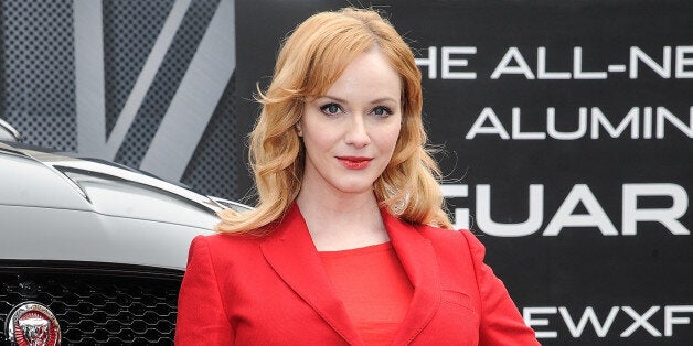 NEW YORK, NY - MARCH 31: Actress, Christina Hendricks, poses with the all-new 2016 Jaguar XF in the Flatiron District of New York City, prior to its global debut at the New York Auto Show on March 31, 2015 in New York City. (Photo by Daniel Zuchnik/WireImage)