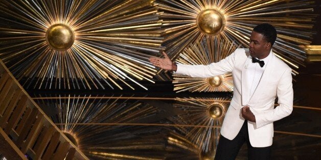 Host Chris Rock speaks on stage at the 88th Oscars on February 28, 2016 in Hollywood, California. AFP PHOTO / MARK RALSTON / AFP / MARK RALSTON (Photo credit should read MARK RALSTON/AFP/Getty Images)