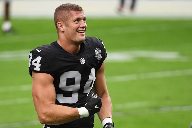 LAS VEGAS, NEVADA - NOVEMBER 15: Carl Nassib #94 of the Las Vegas Raiders flexes while smiling during...