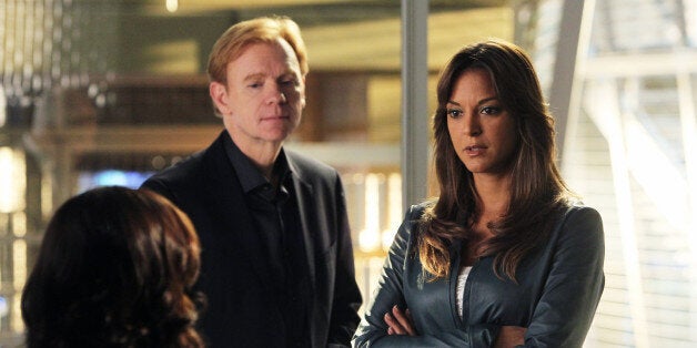 LOS ANGELES - FEBRUARY 7: 'Law and Disorder'-- Horatio (David Caruso, black suit) and Natalia (Eva LaRue, right) uncover a corruption scandal which pits Horatio against an old adversary, on CSI: MIAMI, Sunday, March 25 (10:00-11:00 PM, ET/PT) on the CBS Television Network. (Photo by Monty Brinton/CBS via Getty Images)