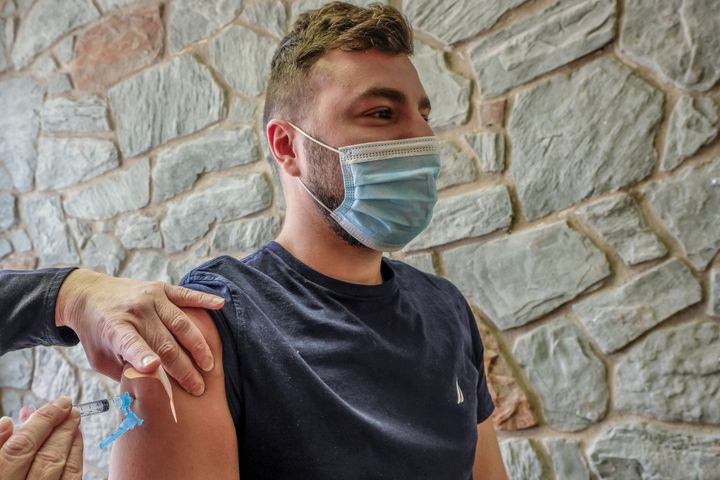 MILFORD, PENNSYLVANIA, UNITED STATES - 2021/05/12: A young man receives his Covid-19 vaccination at a vaccination clinic.People receive the Moderna vaccine in Milford, Pennsylvania. (Photo by Preston Ehrler/SOPA Images/LightRocket via Getty Images)
