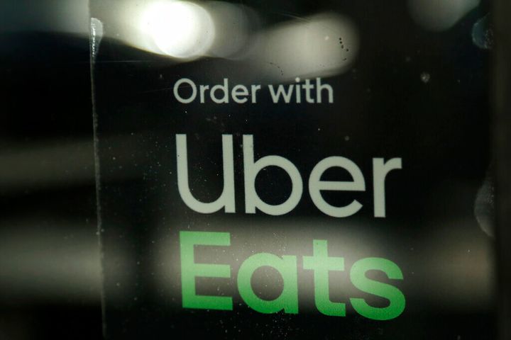 FILE - In this Nov. 6, 2019, file photo, a restaurant advertises Uber Eats in Miami. A civil rights group in Kansas said Tues