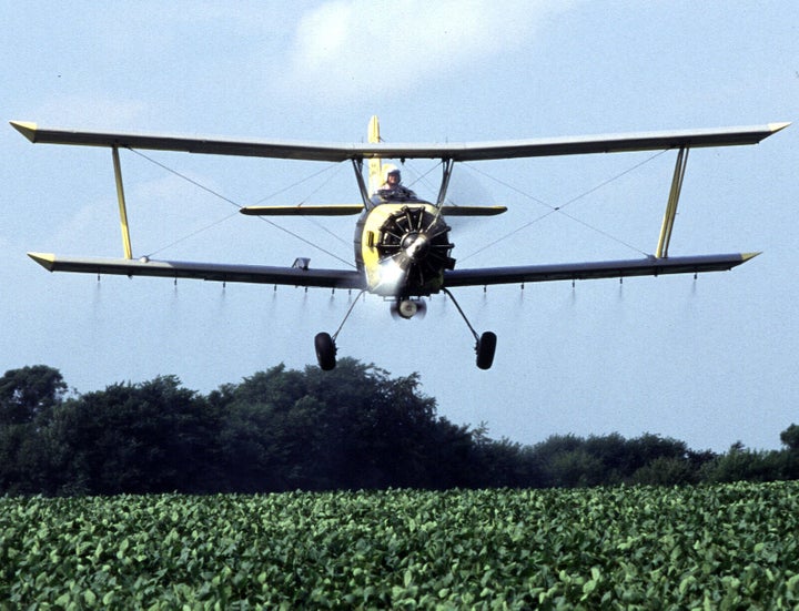 Near Sheldon, Illinois, grower Joe Zumwalt applies a low-insecticide bait that is targeted against western corn rootworms feeding on and ...