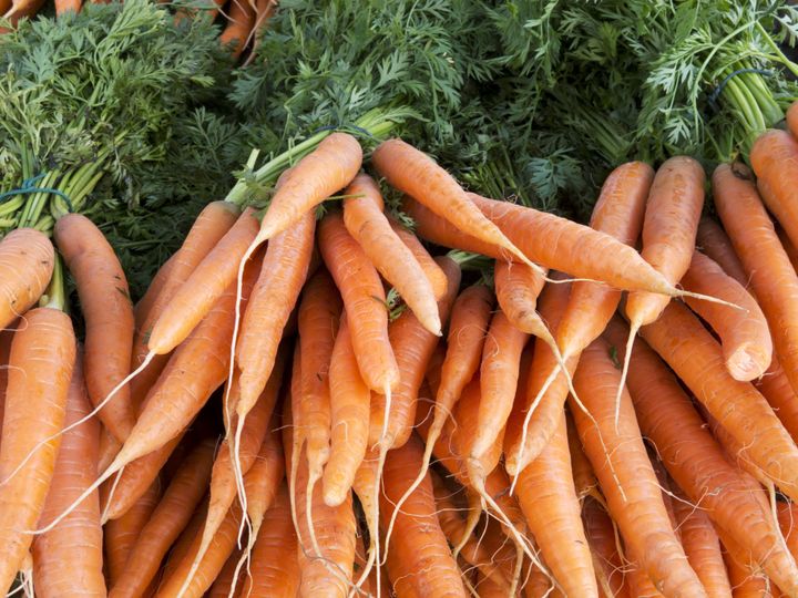 heap of organic carrots at...