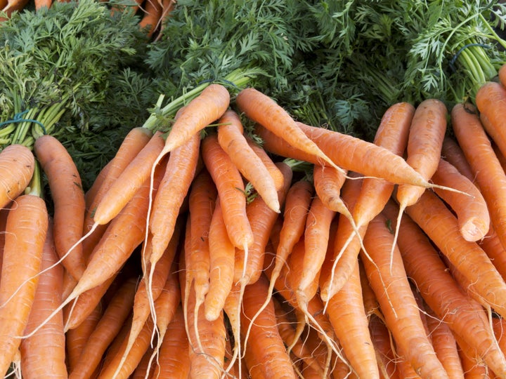 heap of organic carrots at...