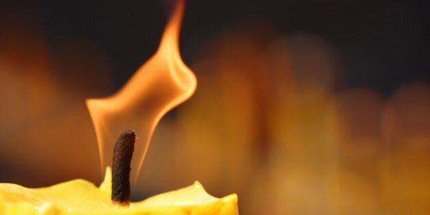 Burning symbolic candle